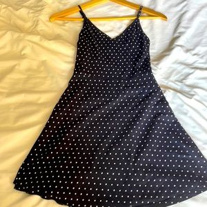 Navy blue spaghetti strap mini dress with white polka dots